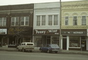 110/112 W WISCONSIN AVE, a Commercial Vernacular retail building, built in Neenah, Wisconsin in 1875.