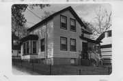 702 E JOHNSON ST, a Gabled Ell house, built in Madison, Wisconsin in 1857.