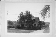 973 BUTLER AVE, a Dutch Colonial Revival house, built in Oshkosh, Wisconsin in 1922.