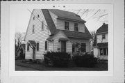 386 ELM ST, a Dutch Colonial Revival house, built in Menasha, Wisconsin in 1921.