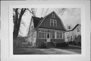 244 4TH ST, a Dutch Colonial Revival house, built in Neenah, Wisconsin in 1907.
