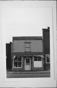 319 N COMMERCIAL ST, a Boomtown retail building, built in Neenah, Wisconsin in 1873.