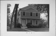 715-715A W 4TH AVE, a Greek Revival house, built in Oshkosh, Wisconsin in 1857.