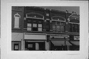 422-424 N MAIN ST, a Queen Anne retail building, built in Oshkosh, Wisconsin in 1884.