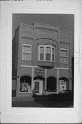544 N MAIN ST, a Queen Anne retail building, built in Oshkosh, Wisconsin in 1891.