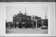 579-581 N MAIN ST, a Queen Anne retail building, built in Oshkosh, Wisconsin in 1895.