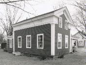 124 E MAIN ST, a Greek Revival house, built in Wautoma, Wisconsin in 1858.
