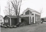 124 E MAIN ST, a Greek Revival house, built in Wautoma, Wisconsin in 1858.