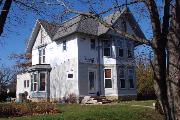 419 S 1ST ST, a Queen Anne house, built in Evansville, Wisconsin in 1885.
