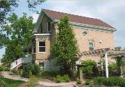 6018 SUPERIOR AVE, a Gabled Ell house, built in Sheboygan, Wisconsin in 1865.