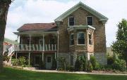 6018 SUPERIOR AVE, a Gabled Ell house, built in Sheboygan, Wisconsin in 1865.