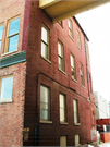 227-229 N WASHINGTON ST, a Commercial Vernacular large retail building, built in Green Bay, Wisconsin in 1887.