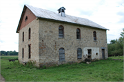 W5539 and W5565 County Rd MM, a Astylistic Utilitarian Building mill, built in Shelby, Wisconsin in 1862.