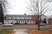 12  E 3RD ST, a Dutch Colonial Revival social recreational/fraternal hall, built in Washburn, Wisconsin in 1918.