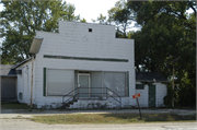 6421 W US HWY 14, a Boomtown retail building, built in Janesville, Wisconsin in 1890.