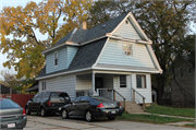 1243 DEWEY AVE, a Dutch Colonial Revival house, built in Beloit, Wisconsin in 1890.
