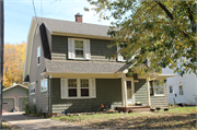 1247 ELM ST, a Dutch Colonial Revival house, built in Beloit, Wisconsin in 1936.