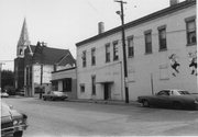 100-110 E MAIN ST, a Queen Anne small retail building, built in Stoughton, Wisconsin in 1897.