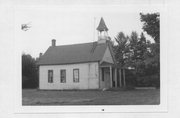 NW CNR OF SUNNYSIDE RD & MACKEY'S SPUR RD 1 MI W OF STATE HIGHWAY 13, a Front Gabled one to six room school, built in Ogema, Wisconsin in 1907.
