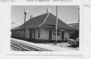 BETWEEN STATE & BROADWAY BY RR TRACKS, a Craftsman depot, built in Medford, Wisconsin in 1913.