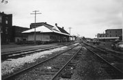 BETWEEN STATE & BROADWAY BY RR TRACKS, a Craftsman depot, built in Medford, Wisconsin in 1913.