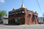 1124-1128 OREGON ST, a Queen Anne retail building, built in Oshkosh, Wisconsin in 1894.