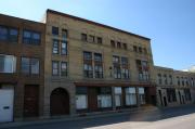 909-913 S MAIN ST, a Romanesque Revival large retail building, built in Oshkosh, Wisconsin in 1902.