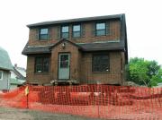 1113 DAY ST (moved from former location at 727 N WEBSTER AVE), a Dutch Colonial Revival house, built in Green Bay, Wisconsin in 1939.