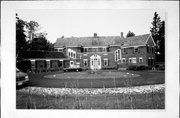 N 933 NEBRASKA ROW, a Colonial Revival/Georgian Revival house, built in La Pointe, Wisconsin in 1924.