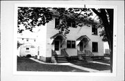 813-815 W OREGON ST, a Colonial Revival/Georgian Revival duplex, built in Green Bay, Wisconsin in 1900.