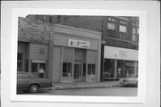 13 E CENTRAL ST, a Commercial Vernacular small retail building, built in Chippewa Falls, Wisconsin in 1890.