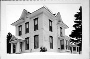 8 W Elm St, a Two Story Cube house, built in Chippewa Falls, Wisconsin in 1873.