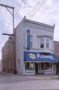 211 DEWITT, a Commercial Vernacular retail building, built in Portage, Wisconsin in 1899.