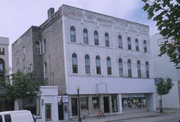 228-230 W WISCONSIN, a Romanesque Revival lodging-hotel, built in Portage, Wisconsin in 1869.