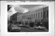 118-122 W COOK ST, a Italianate retail building, built in Portage, Wisconsin in 1869.