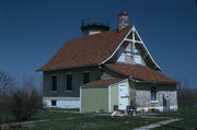 10971 BASE LINE RD, a Front Gabled light house, built in Gibraltar, Wisconsin in 1868.