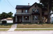 818 N 6th St, a Gabled Ell house, built in Manitowoc, Wisconsin in 1898.