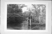 OVER BRULE RIVER .6 MI N OF COUNTY HIGHWAY B, .25 MI W OF CONGDON RD, a NA (unknown or not a building) wood bridge, built in Brule, Wisconsin in .