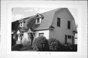 1801-03 CUMMINGS AVE, a Dutch Colonial Revival duplex, built in Superior, Wisconsin in 1911.
