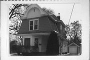 1103 3RD AVE E, a Dutch Colonial Revival house, built in Menomonie, Wisconsin in 1907.