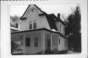 1109 3RD AVE E, a Dutch Colonial Revival house, built in Menomonie, Wisconsin in 1907.