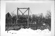 ACROSS EAU CLAIRE RIVER, N OF BOYD PARK PLAYGROUND, a NA (unknown or not a building) suspension bridge, built in Eau Claire, Wisconsin in 1932.
