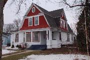 244 W PINE ST, a Dutch Colonial Revival house, built in Lancaster, Wisconsin in 1910.