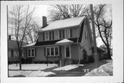 176 7TH ST, a Dutch Colonial Revival house, built in Fond du Lac, Wisconsin in 1927.