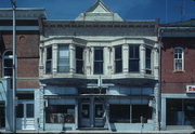 205 W MAPLE ST, a Queen Anne retail building, built in Lancaster, Wisconsin in 1904.