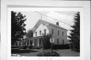 407 S ADAMS ST, a Greek Revival house, built in Lancaster, Wisconsin in 1866.