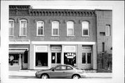 115 W MAPLE ST, a Commercial Vernacular retail building, built in Lancaster, Wisconsin in 1888.