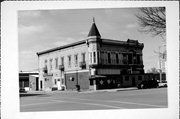 107 S WISCONSIN AVE, a Queen Anne retail building, built in Muscoda, Wisconsin in 1892.