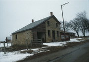 DOYLE RD, north side, 0.6 mi. from Co. Rd. D, a Gabled Ell house, built in Exeter, Wisconsin in 1861.