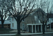 112 6TH AVE, a Greek Revival house, built in New Glarus, Wisconsin in 1859.